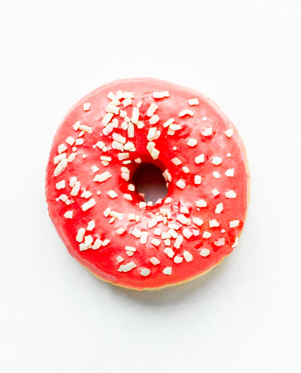 cherry glaze donut with white sprinkles